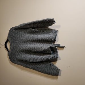 Olive green knitwear sweater size small with opening and knot in the back.